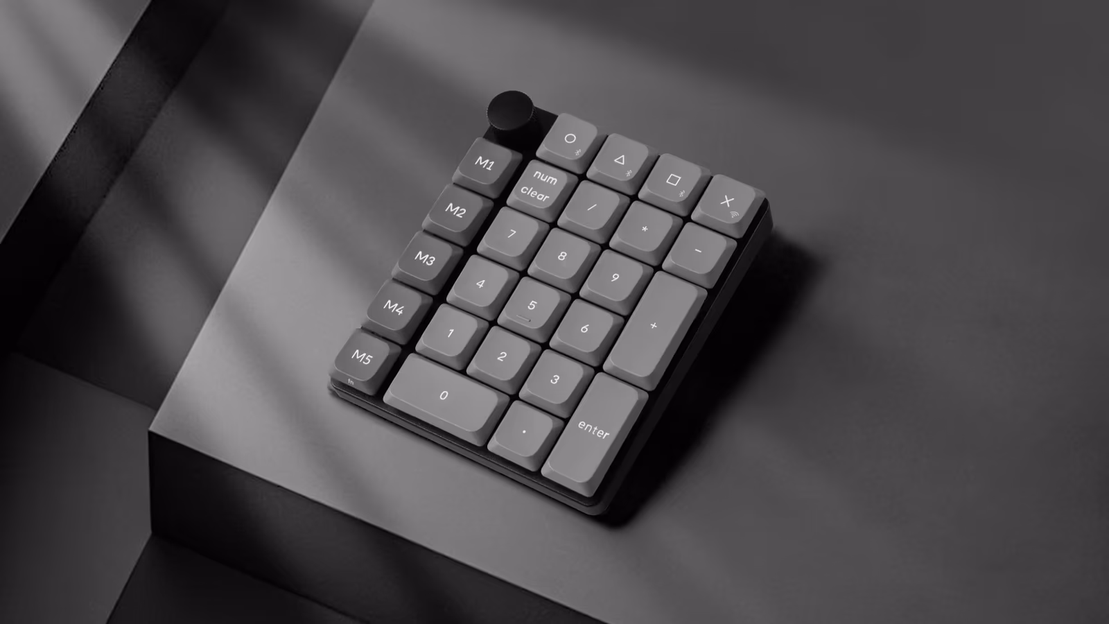Keychron K0 Max shown at an angle with its numeric layout and macro keys