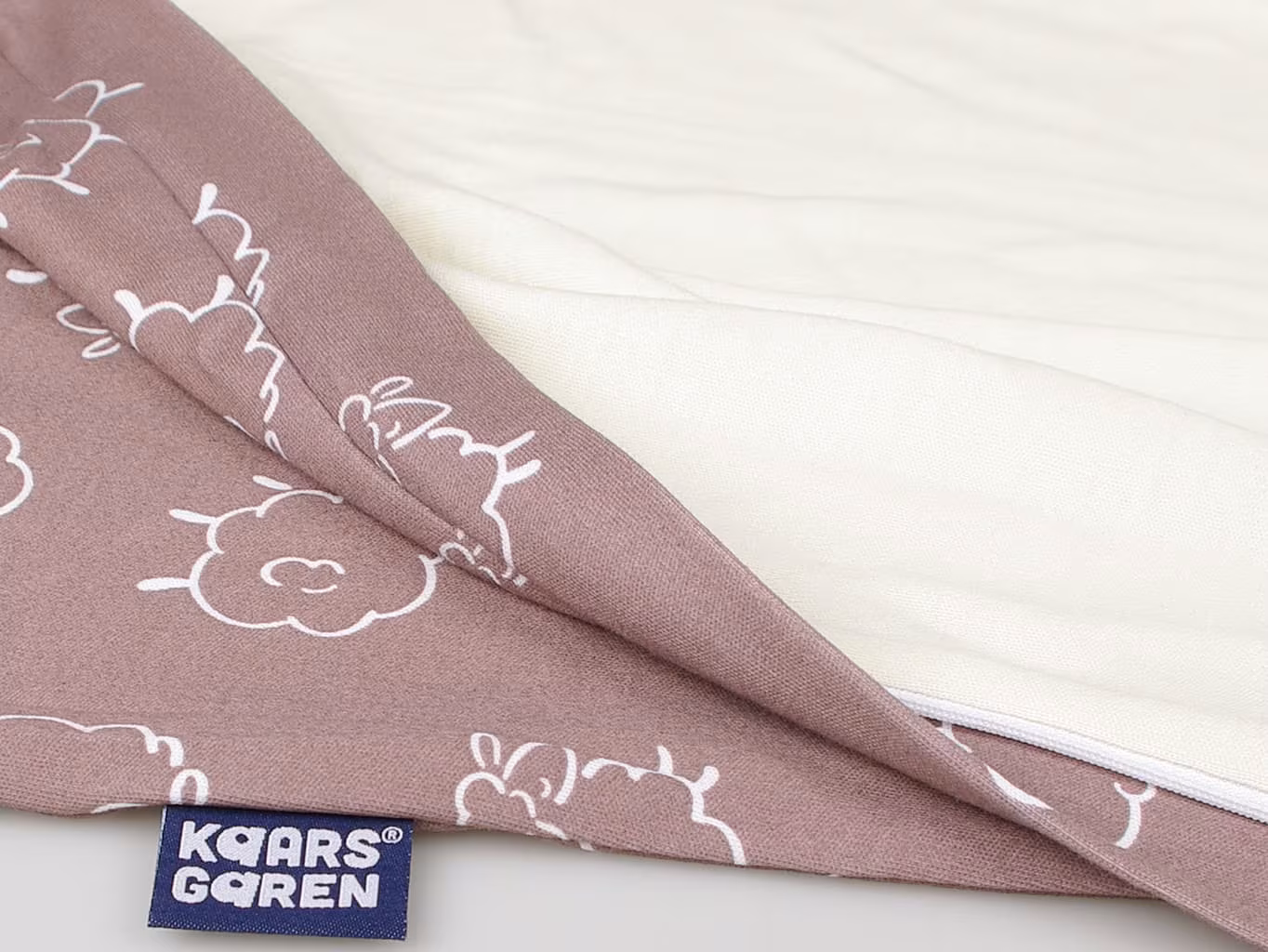 Detail of the cotton outer, the merino lining and the label
