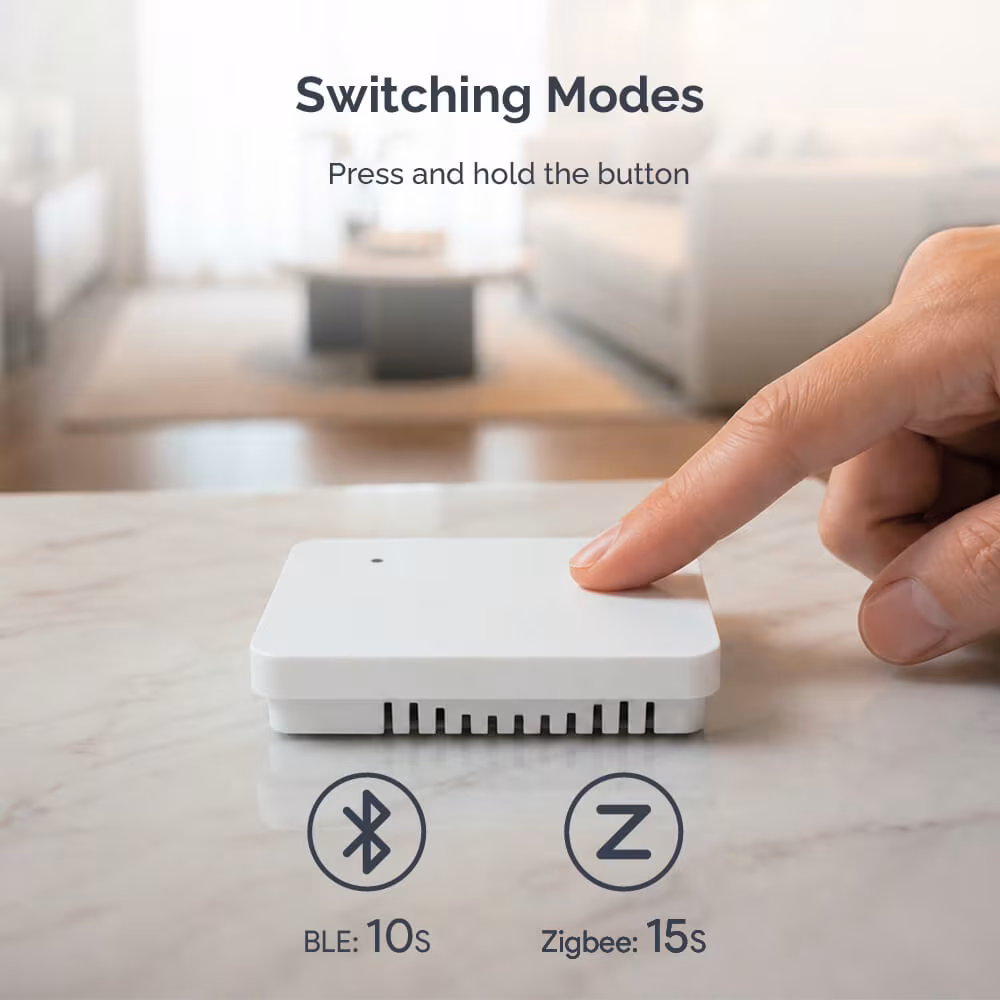 Holding the button for 10 seconds selects Bluetooth and for 15 seconds Zigbee